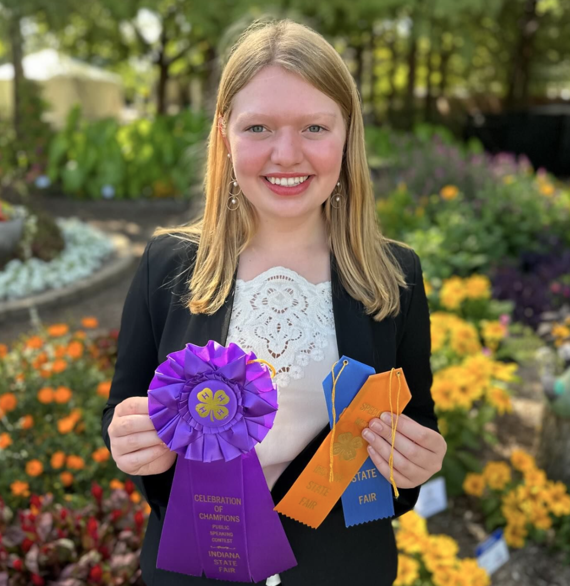 Sophia Beeson '25 with several of her championship ribbons from the 4-H Fair. Picture from GoCathedral Instagram. "Communication is an extremely important skill that many of us don’t realize we lack until it is too late," Beeson said.